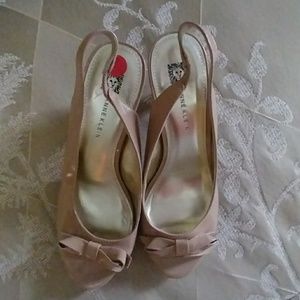 New taupe patent leather sling backs with cute bow